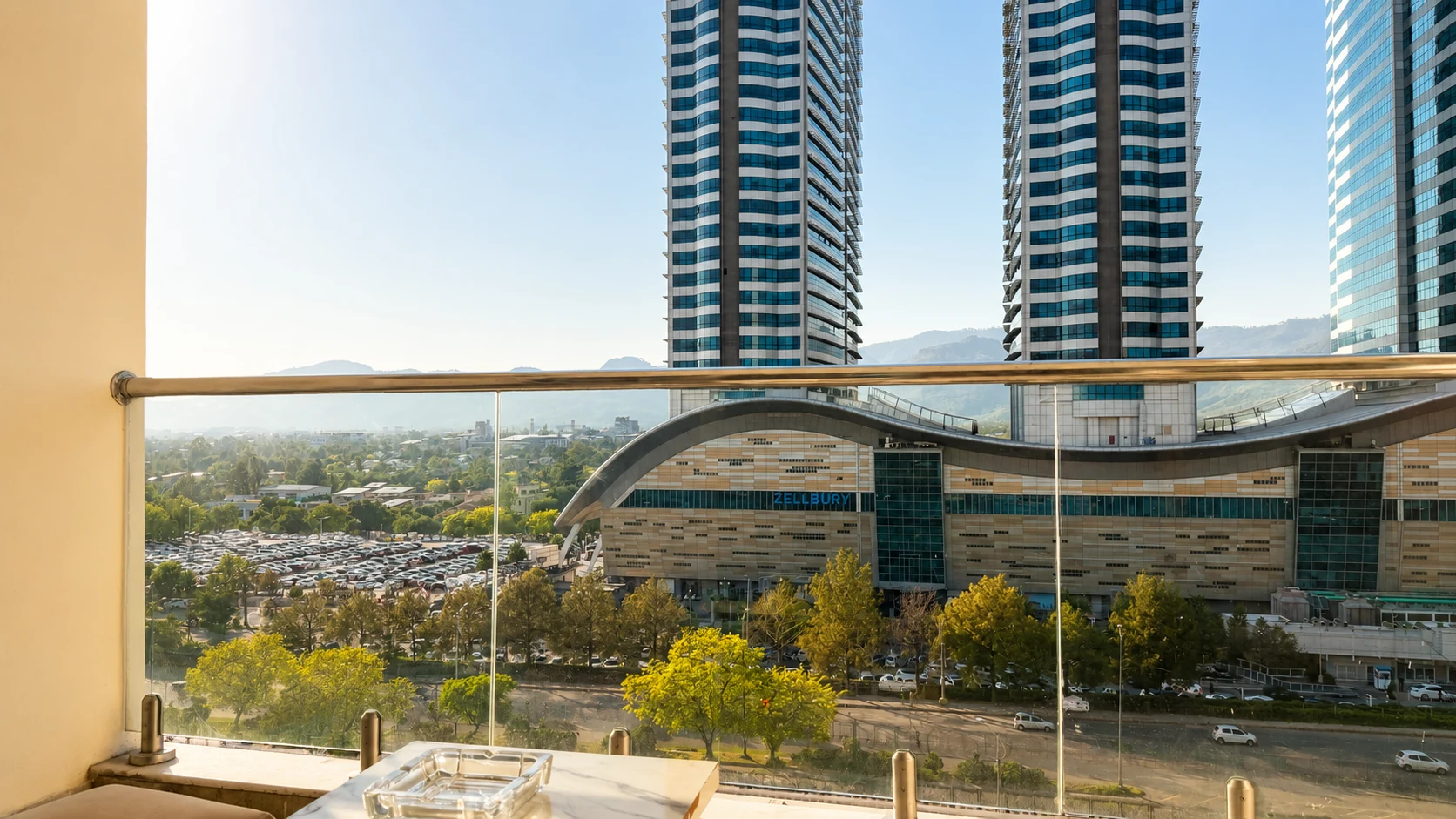 Panoramic city and mountain view from balcony at Elysium Tower Islamabad