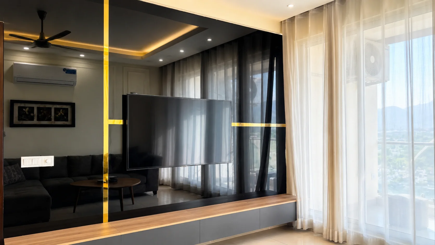Modern multimedia wall and living area in corporate apartment at Elysium Tower Islamabad